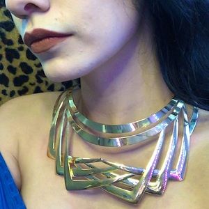 Adjustable gold statement necklace.